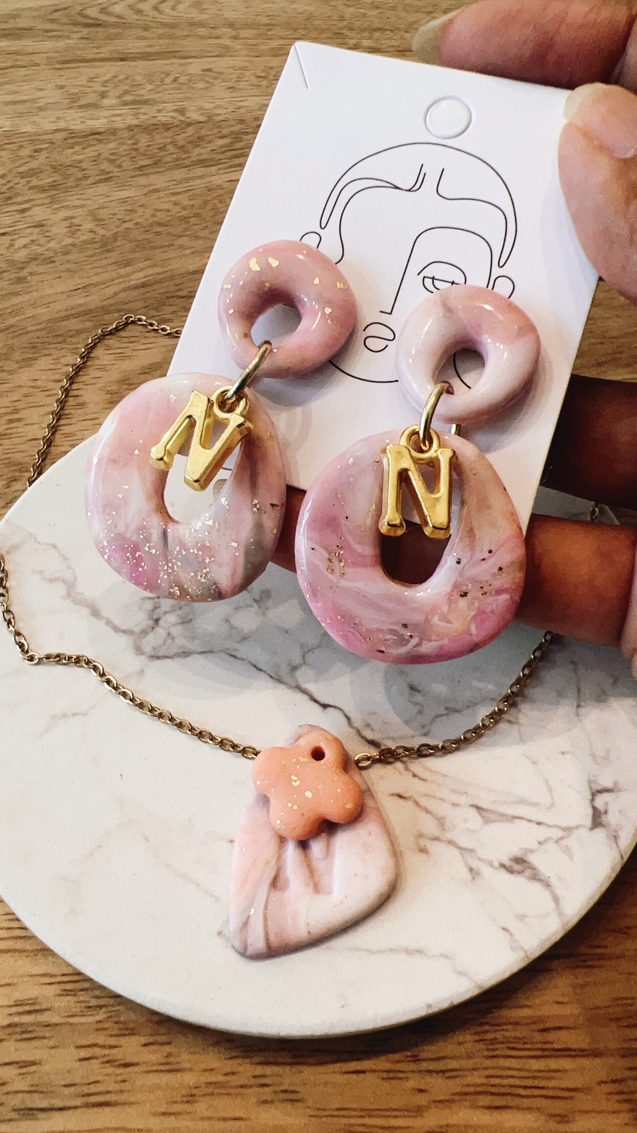 Marble clay flower ring and dangle earrings worn