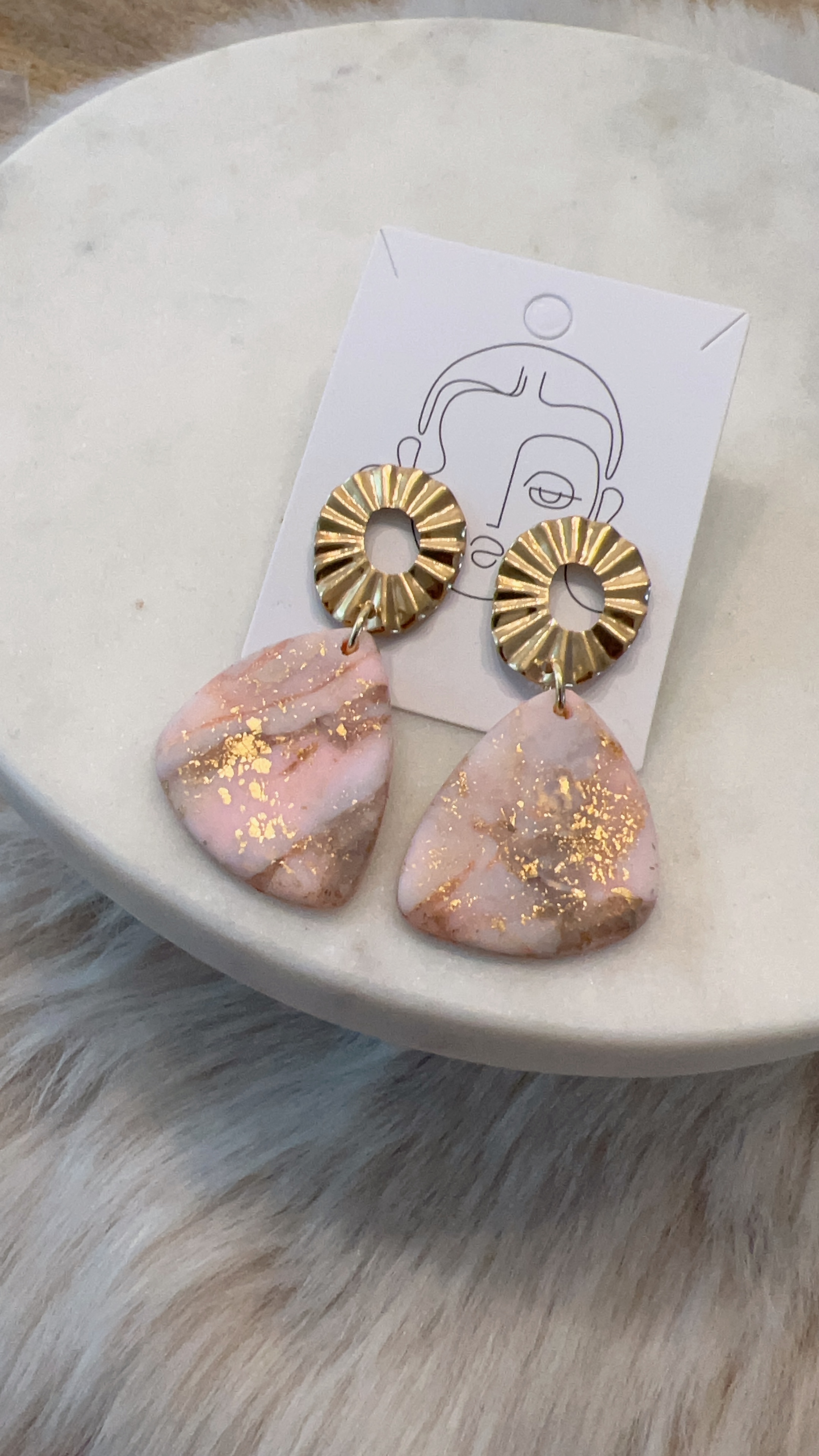 Pink and gold flake donut earrings on card